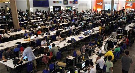 People surf the web during a "Campus Party" Internet users gathering in Sao Paulo